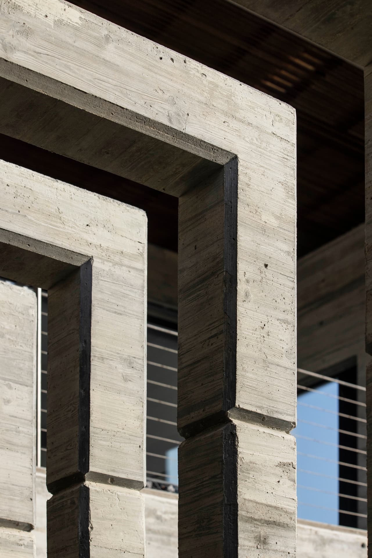 Board-formed concrete, terrazzo floor and wood ceiling