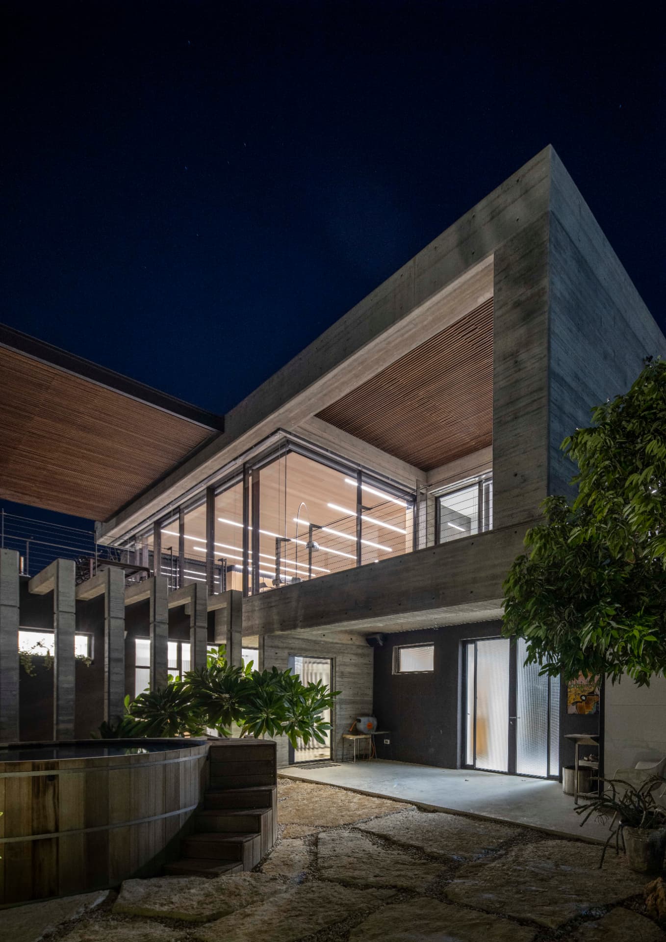 Hot tub and house under the night sky